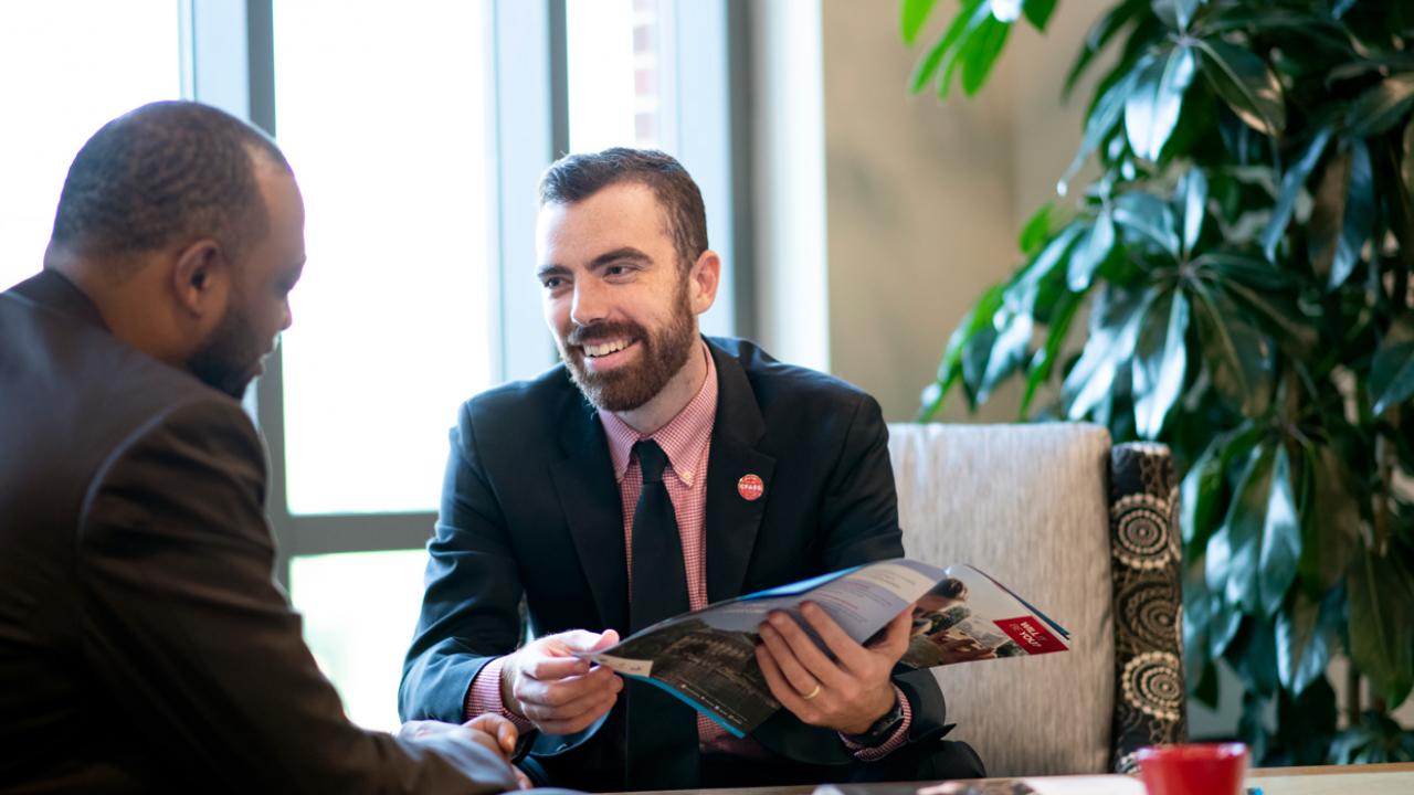 Ohio State University Advancement employees chat in the Ohio Union